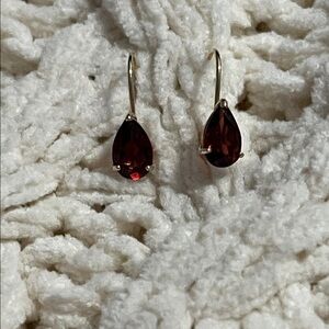 Beautiful 14 kt yellow gold deep color garnet leverback earrings.